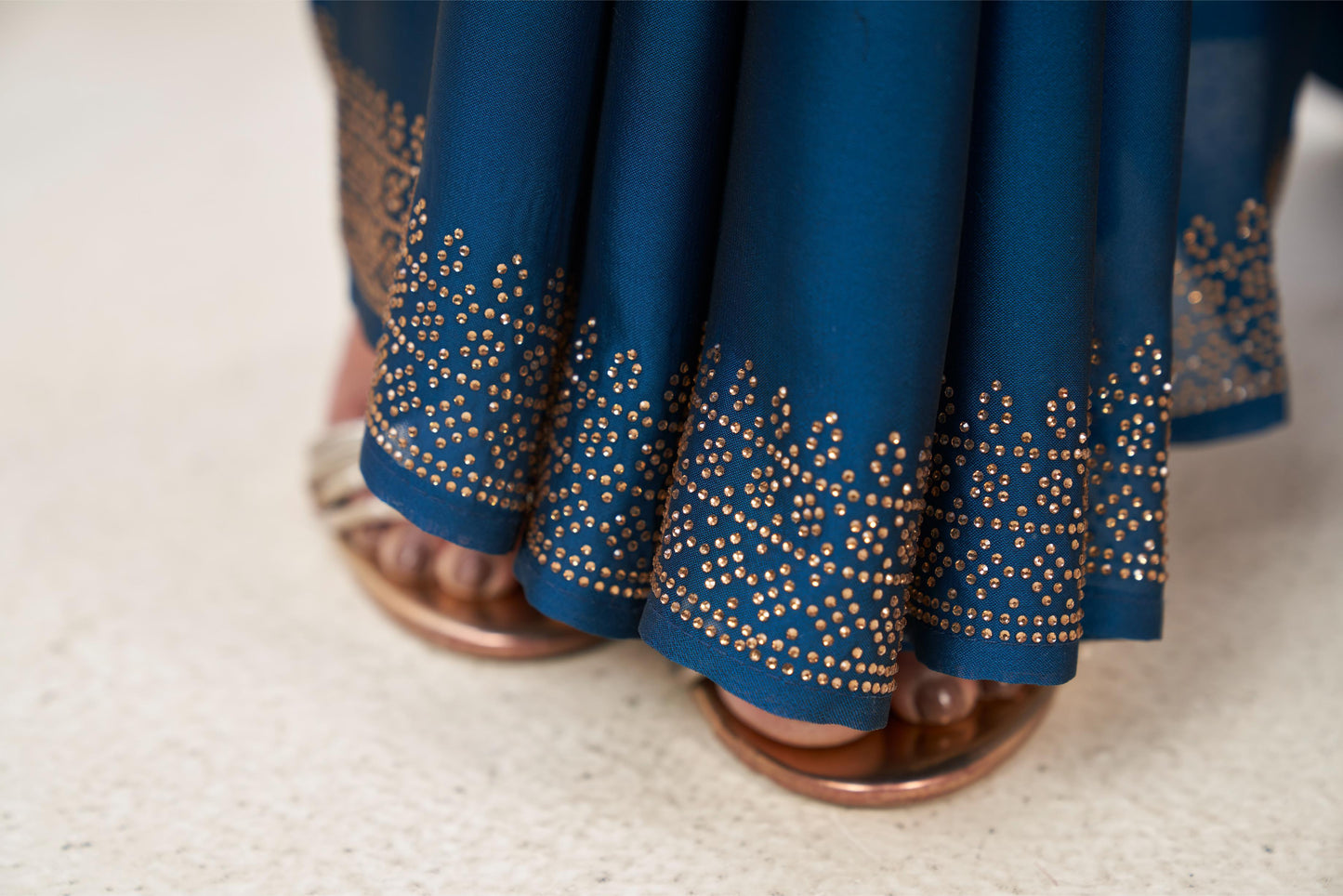 Enchanting Turquoise Blue Georgette Saree with Sarvoski Stone Border