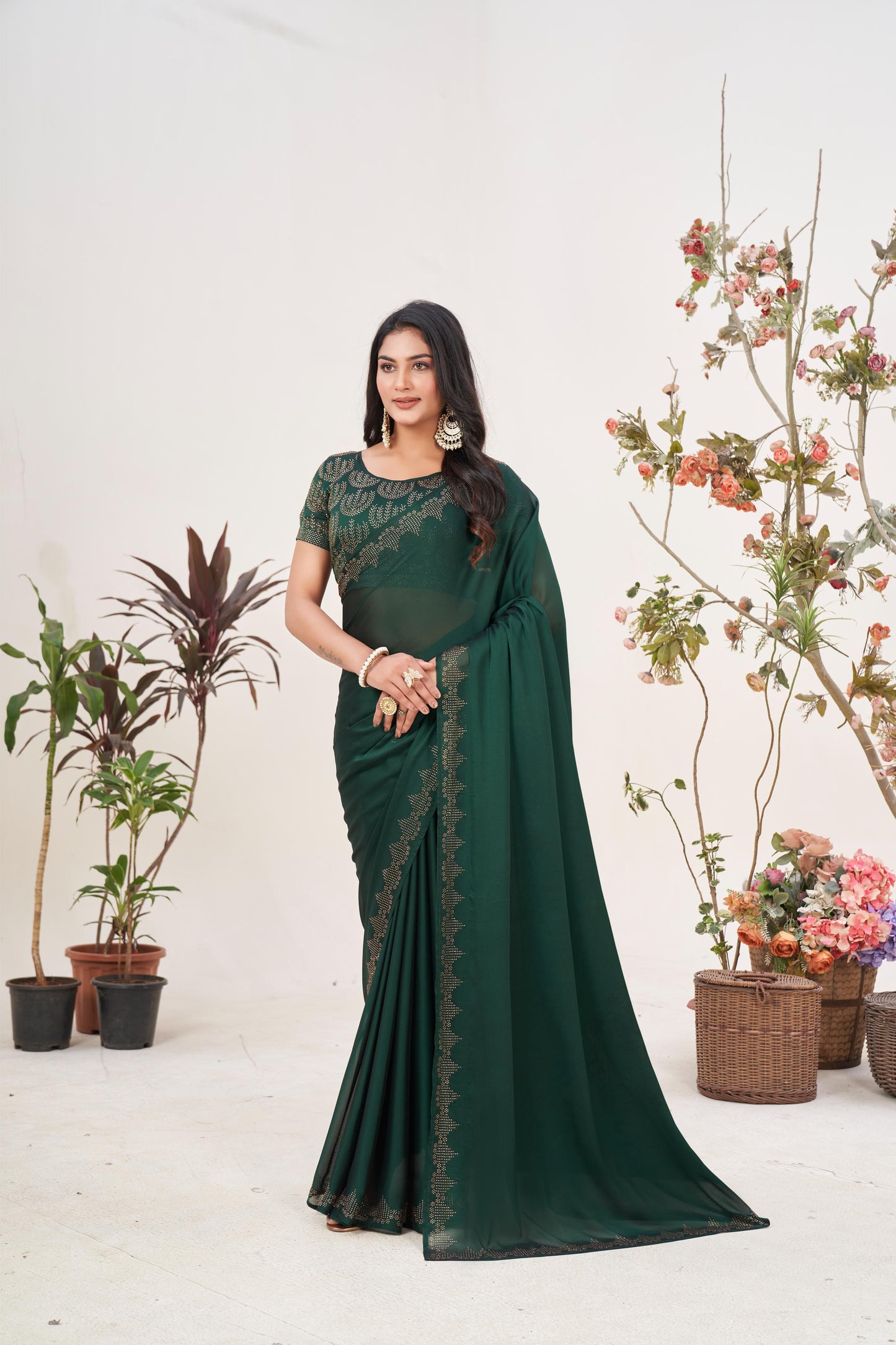Regal Bottle Green Georgette Saree with Sarvoski Stone Border