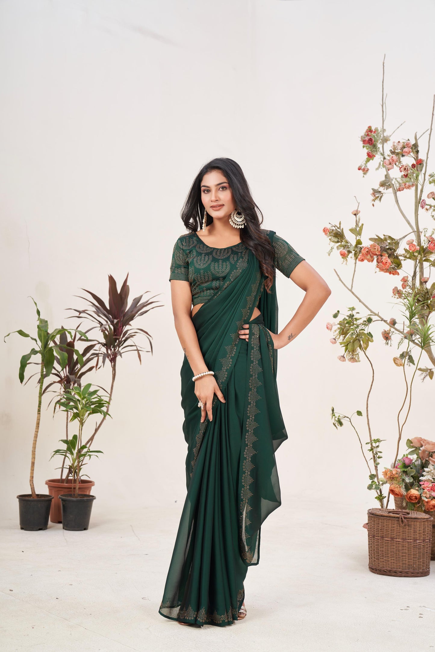 Regal Bottle Green Georgette Saree with Sarvoski Stone Border