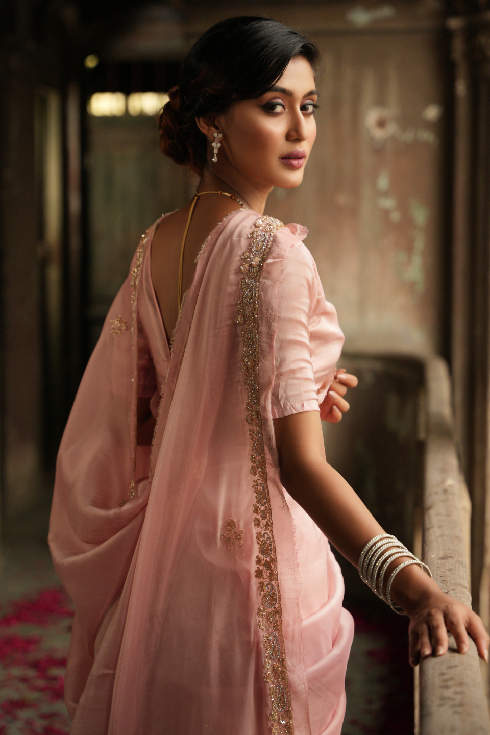 Whispers of Elegance: Light Peach Organza Silk Saree with Zardozi Buti & Grand Border