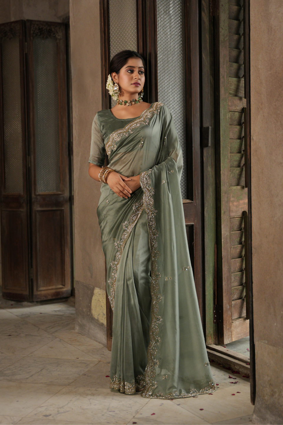 Sage Serenade: Tissue Organza Saree with Lustrous Buti & Majestic Nine Yard Border