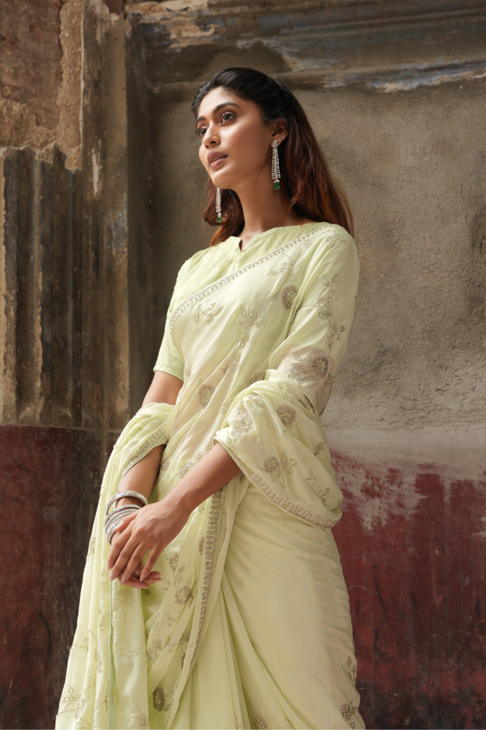 Whispers of Nature: Pastel Lime Green Chinnon Crape Saree Adorned with Ethereal Jaal & Katdana