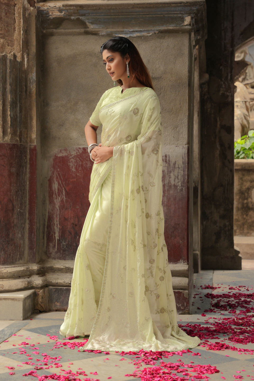 Whispers of Nature: Pastel Lime Green Chinnon Crape Saree Adorned with Ethereal Jaal & Katdana