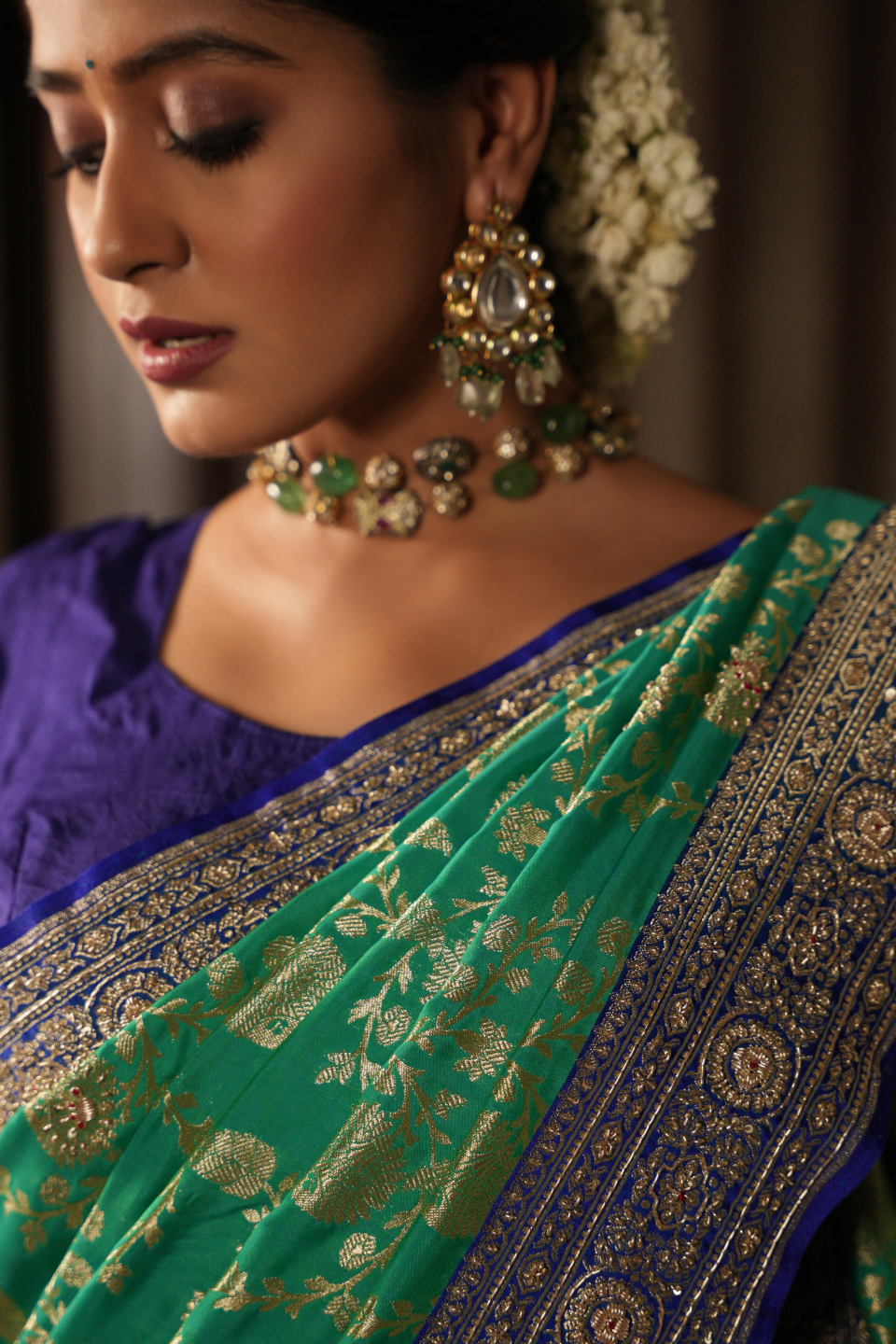 Emerald & Azure Elegance: Green Banarasi Silk Saree with Blue Zardozi-Adorned Border