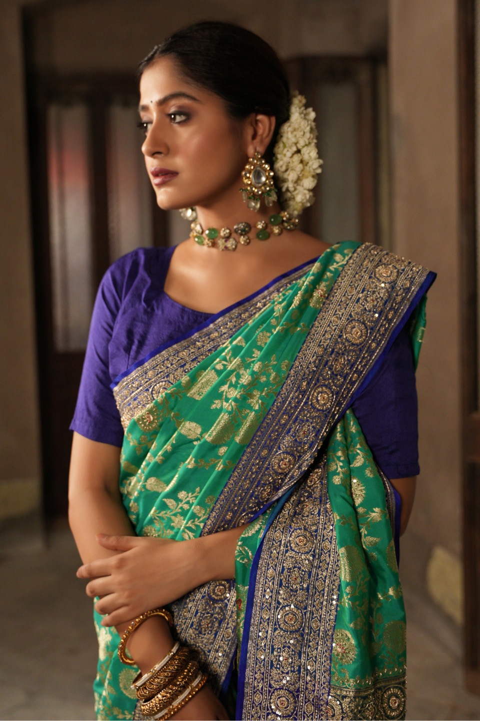 Emerald & Azure Elegance: Green Banarasi Silk Saree with Blue Zardozi-Adorned Border