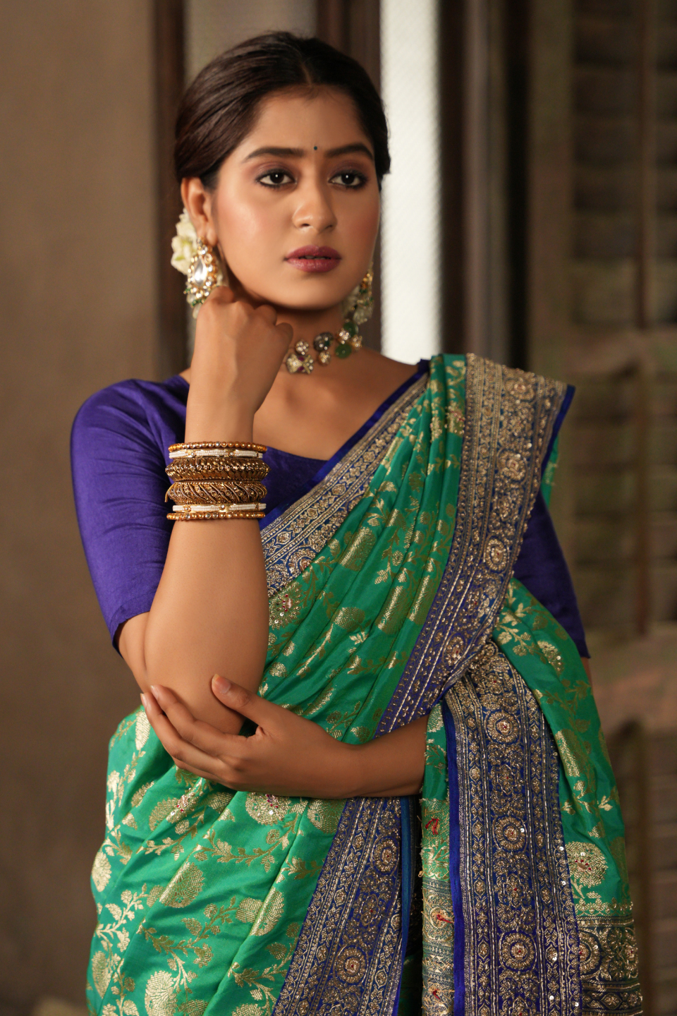 Emerald & Azure Elegance: Green Banarasi Silk Saree with Blue Zardozi-Adorned Border