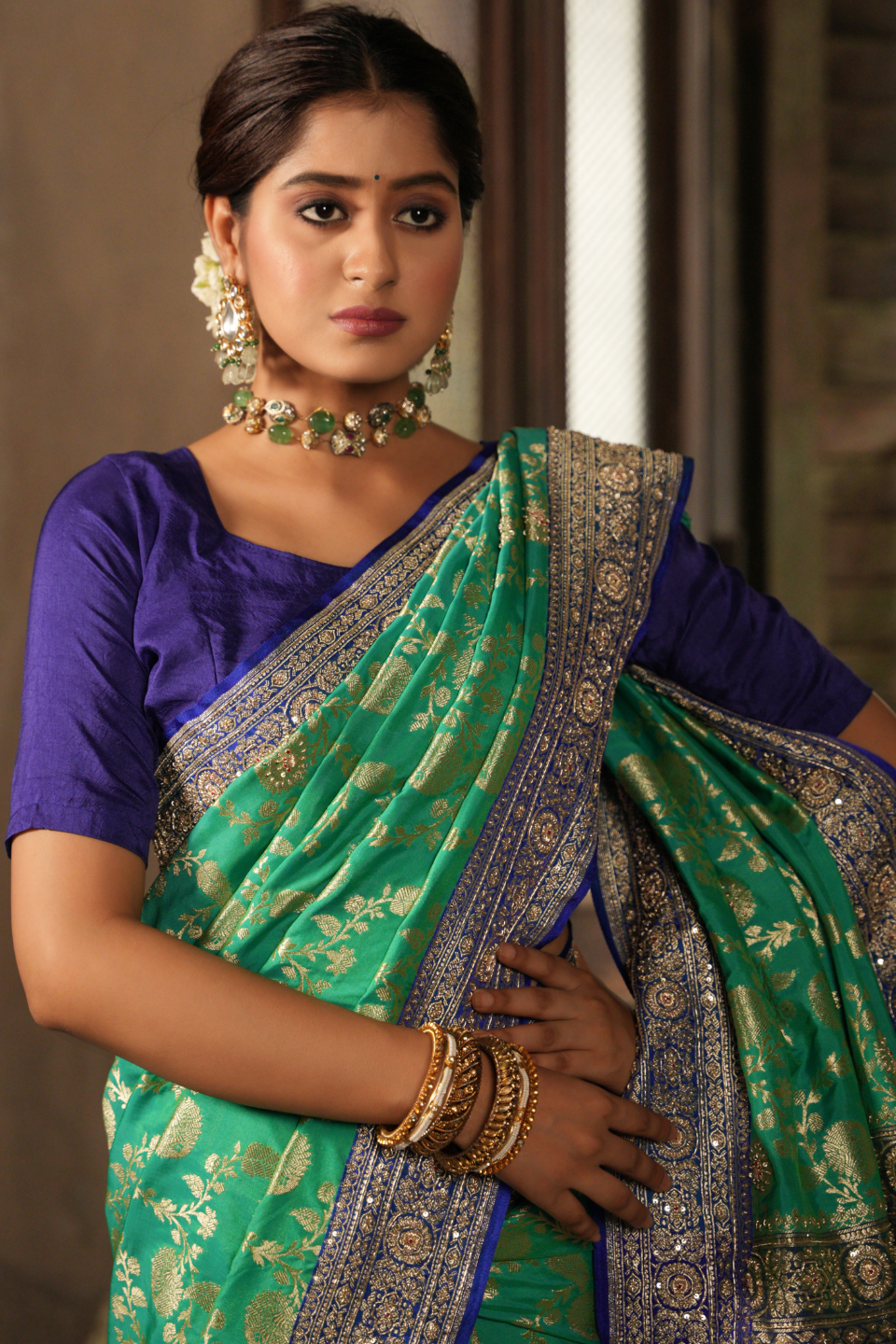 Emerald & Azure Elegance: Green Banarasi Silk Saree with Blue Zardozi-Adorned Border