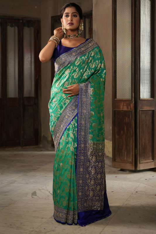 Emerald & Azure Elegance: Green Banarasi Silk Saree with Blue Zardozi-Adorned Border